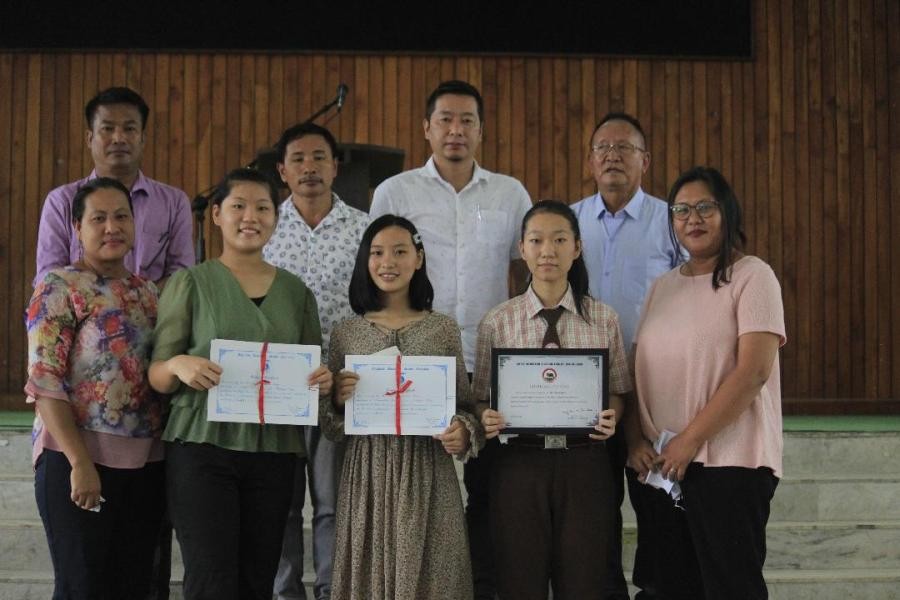 Board members and faculty of Green Wood School along with the three meritorious students and their parents at the felicitation programme held on August 23.